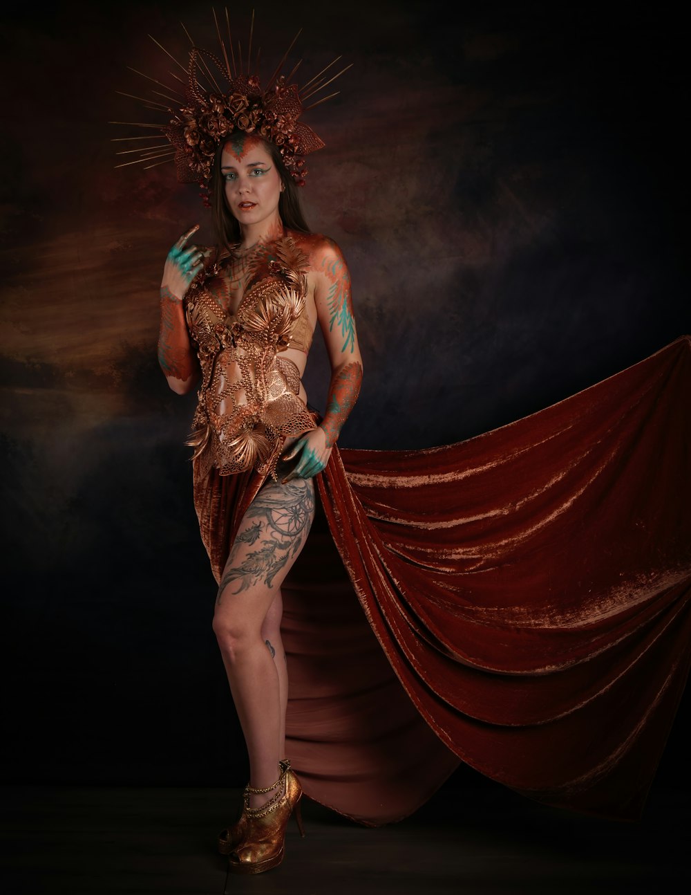a woman in a costume with tattoos on her body