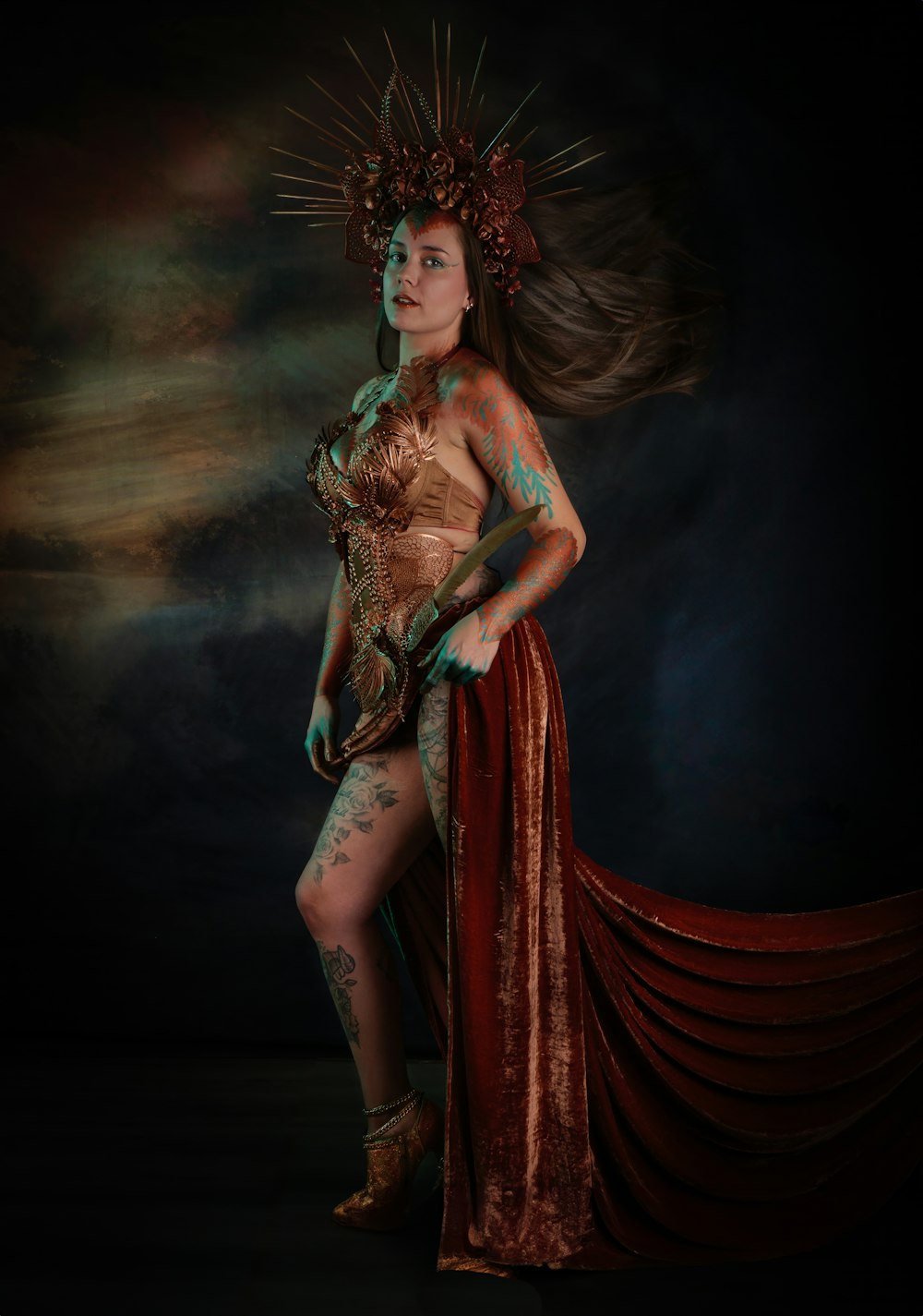 a woman in a costume with tattoos on her body