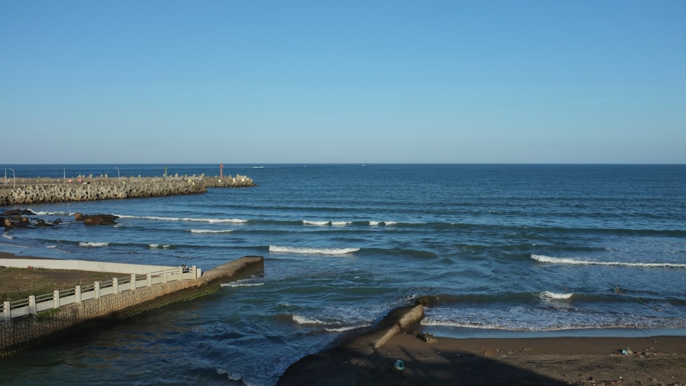 a body of water with waves coming in to shore