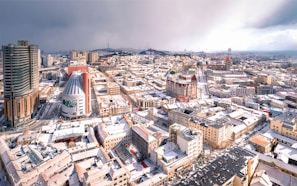 an aerial view of a city with tall buildings