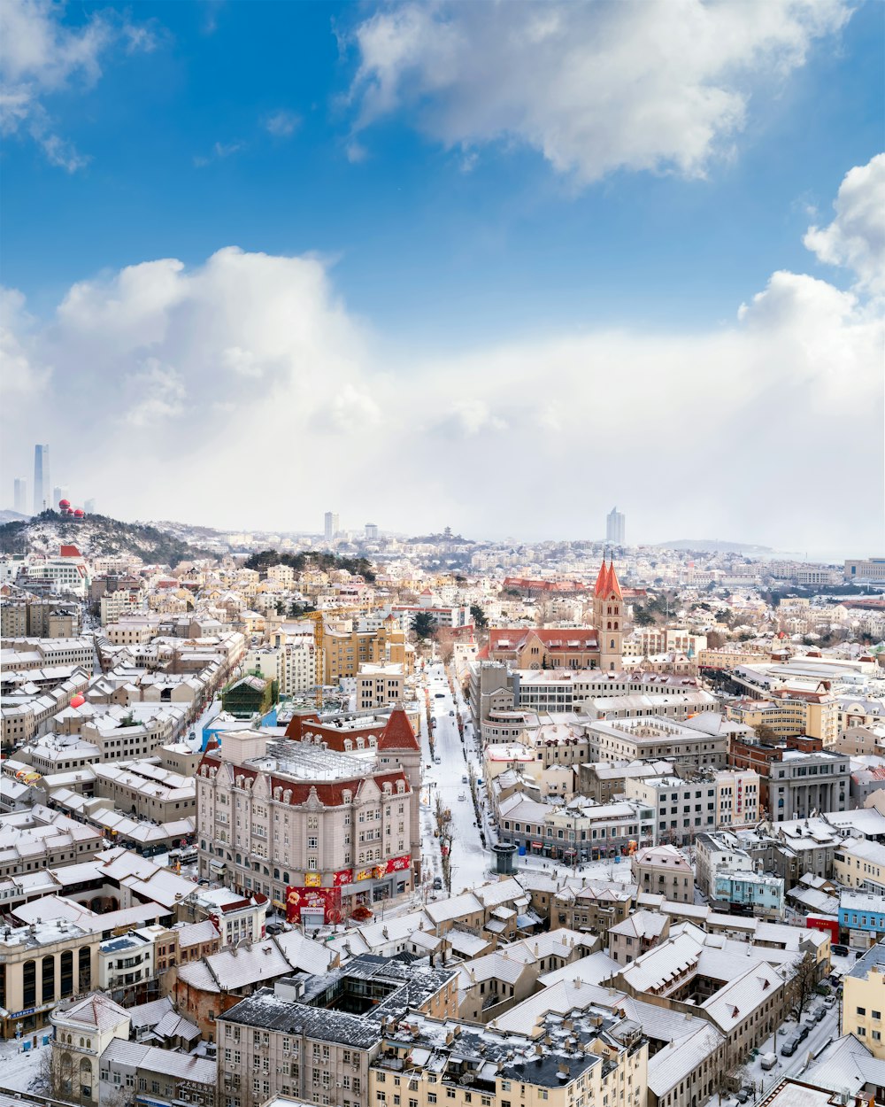 a view of a city with snow on the ground