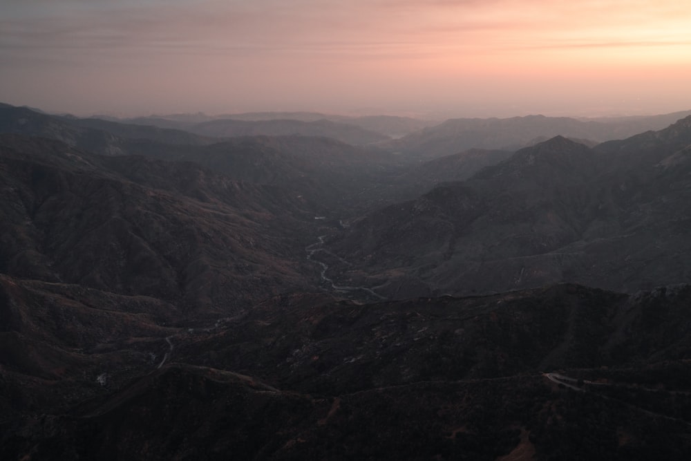 a view of a mountain range with a river running through it