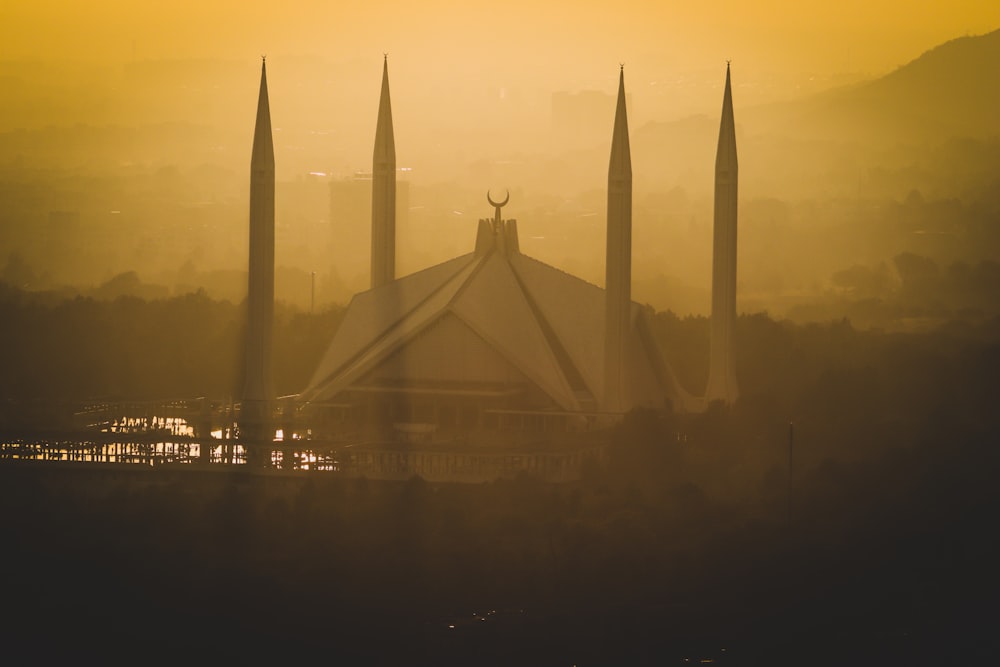 a view of a building in the middle of a foggy day