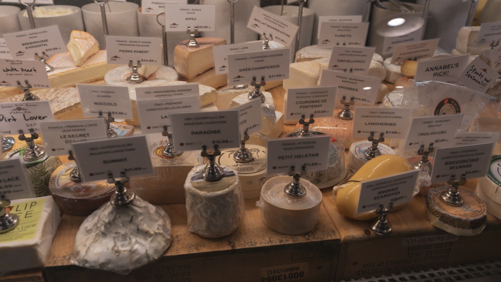 a bunch of cheeses are on a table