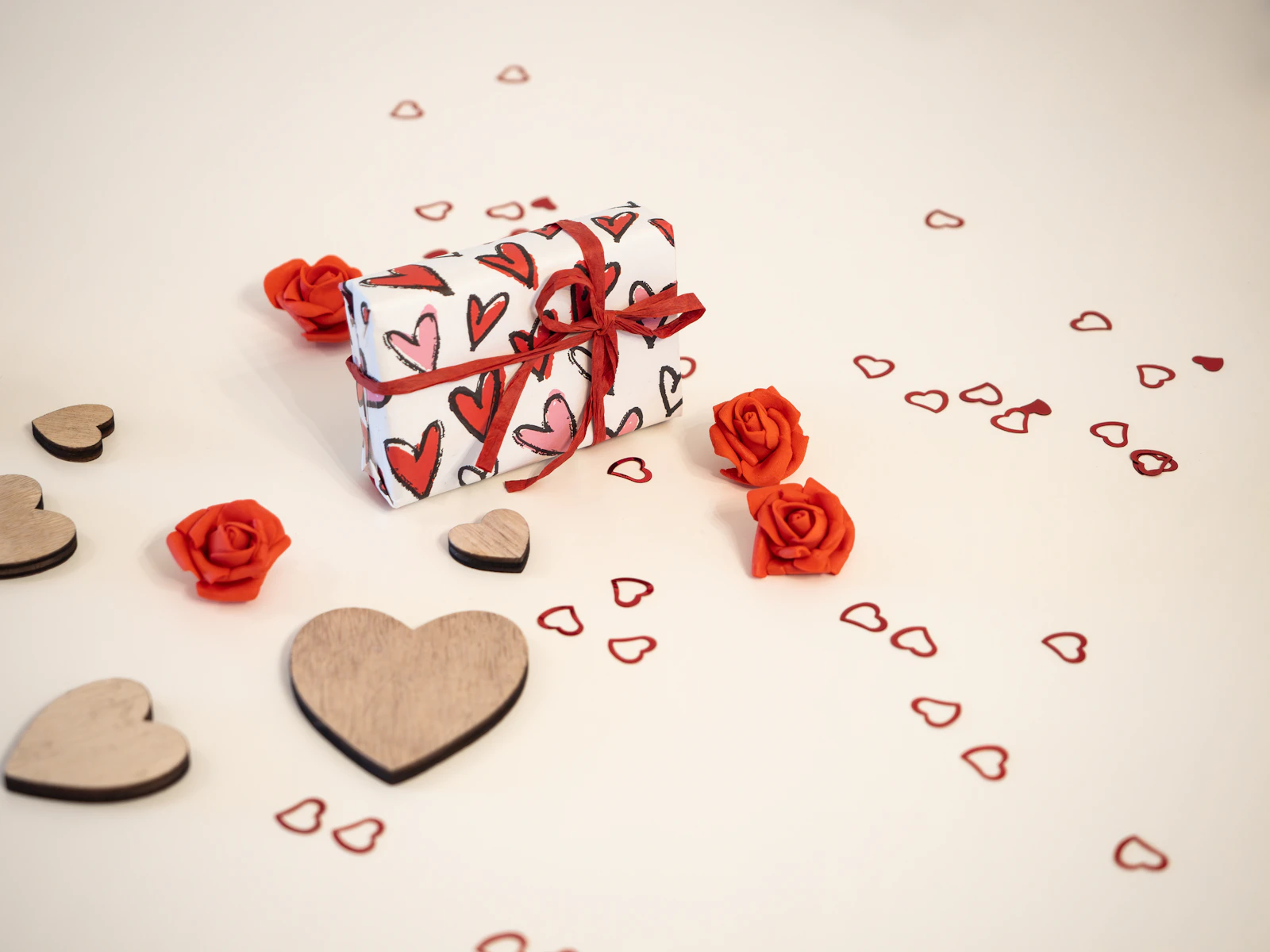 Last-minute anniversary gift surrounded by hearts and roses
