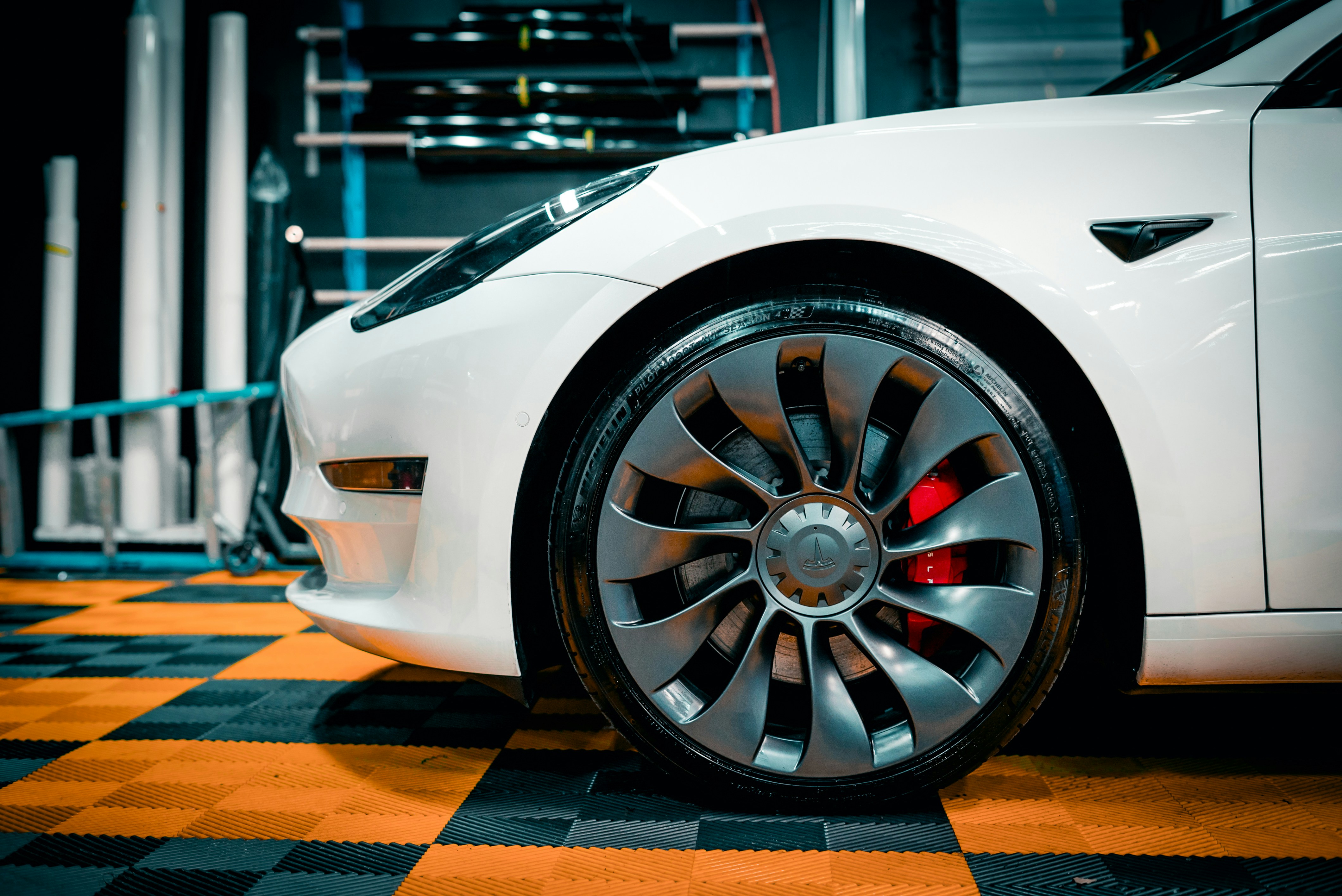 White car on checkered floor