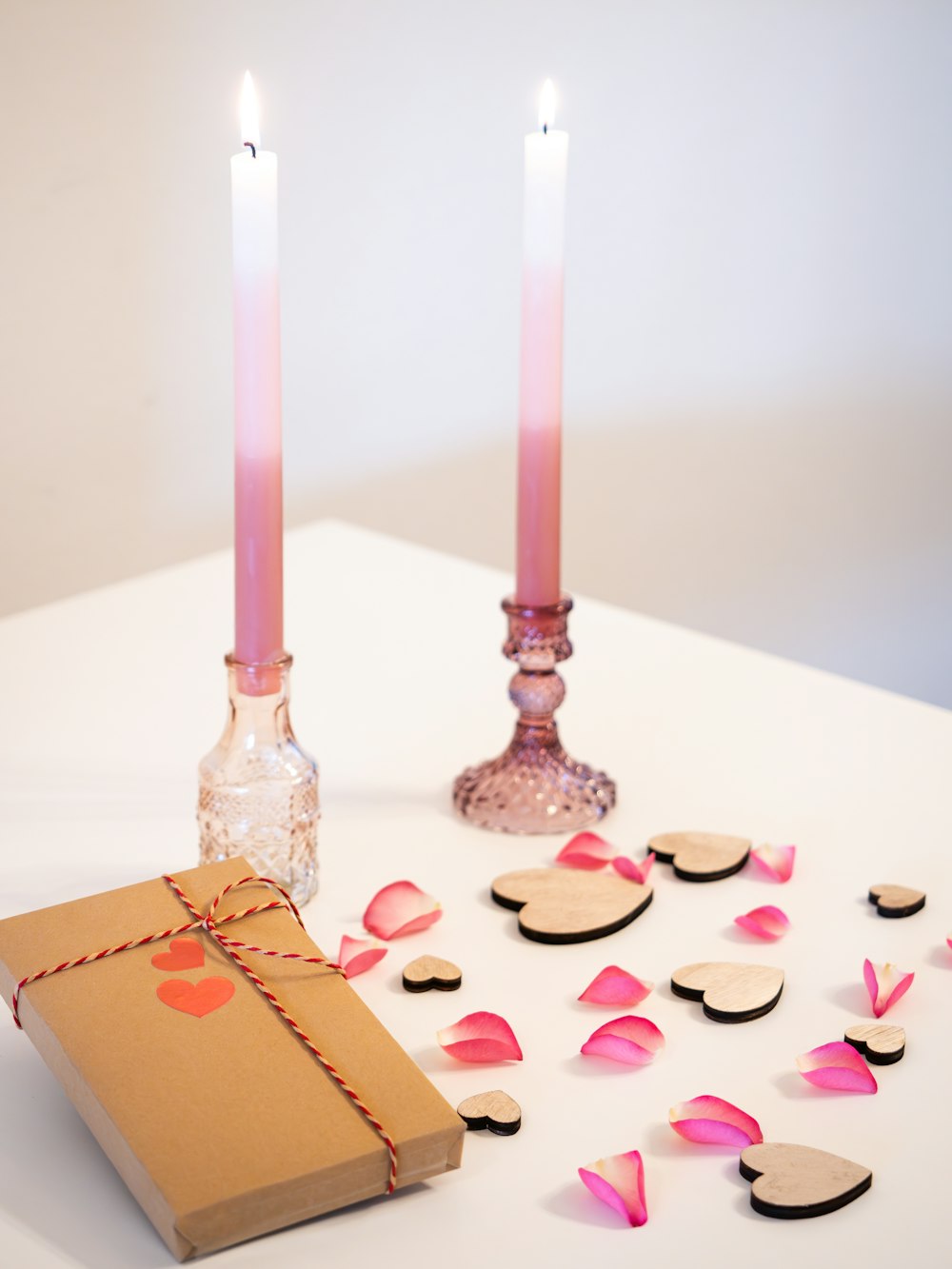 a box and two candles on a table