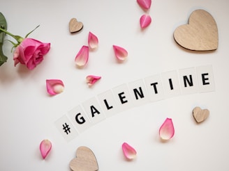 the word valentine spelled with scrabbles and flowers