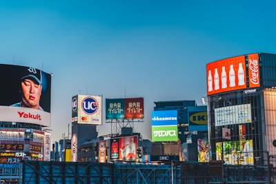 a city with lots of billboards and buildings