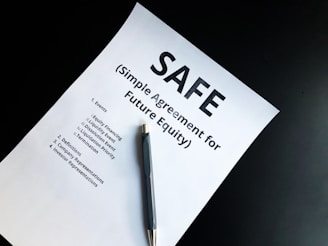 a pen sitting on top of a piece of paper