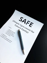 a pen sitting on top of a piece of paper