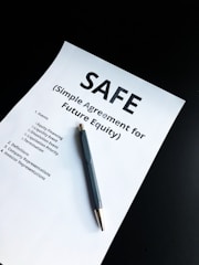 a pen sitting on top of a piece of paper