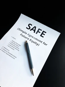 a pen sitting on top of a piece of paper