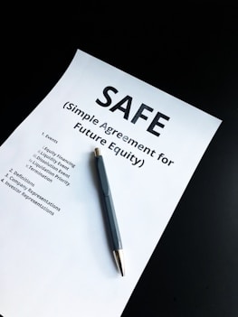 a pen sitting on top of a piece of paper