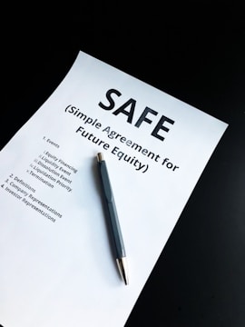 a pen sitting on top of a piece of paper