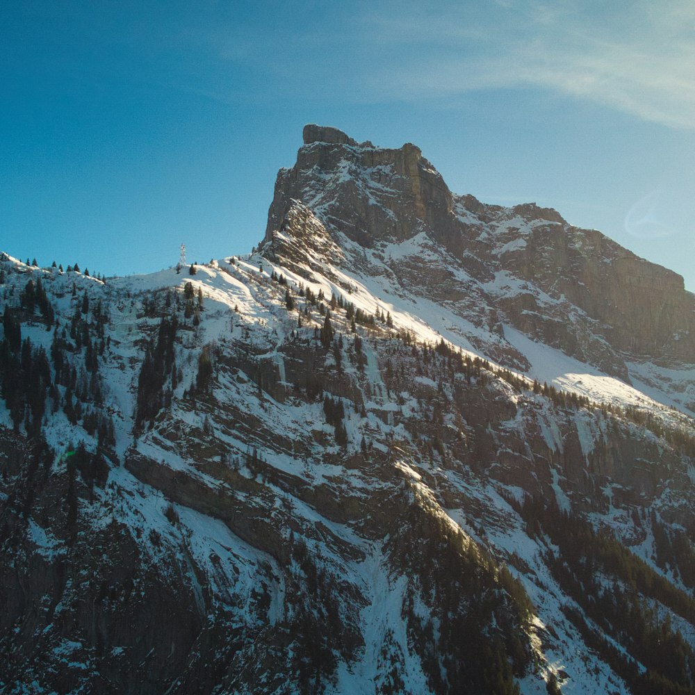 a snow covered mountain with a sky background