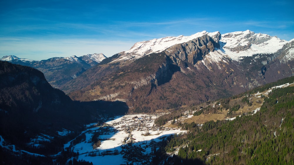 a view of a mountain range with snow on it