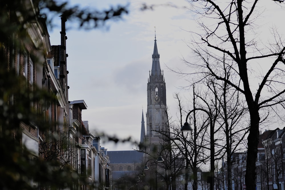 a church steeple towering over a city street