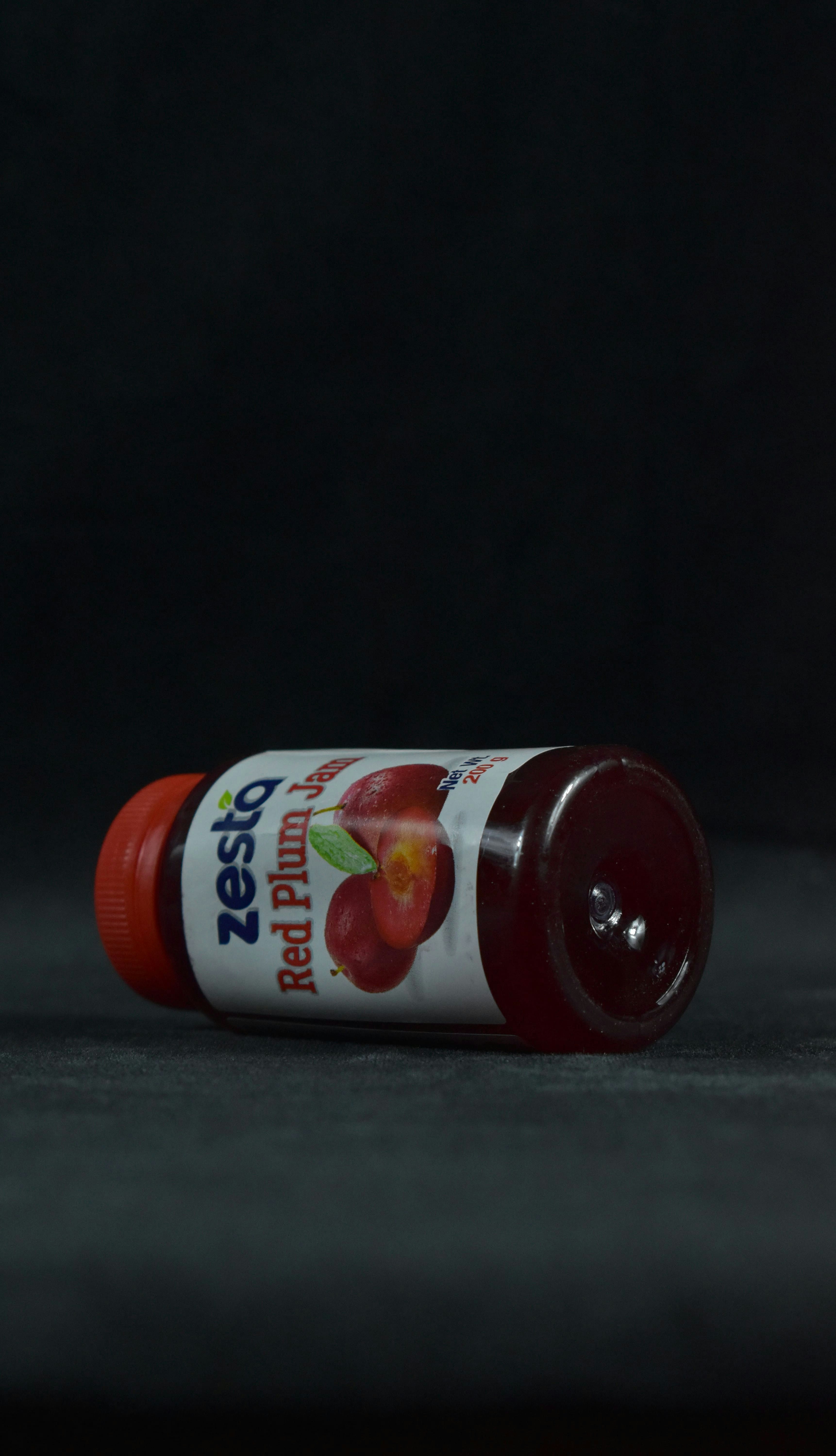 a bottle of ketchup sitting on a table