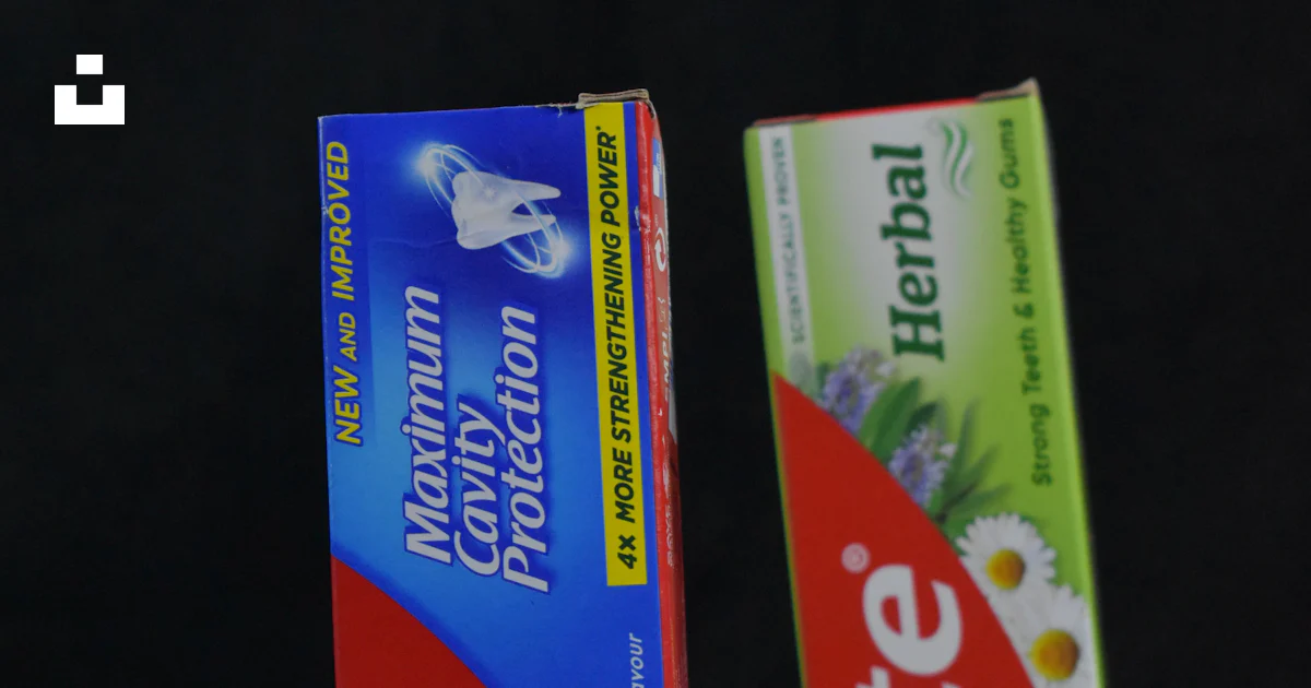 Two Part Toothpaste Two tubes of toothpaste sitting next to each other photo – Free Paper ...