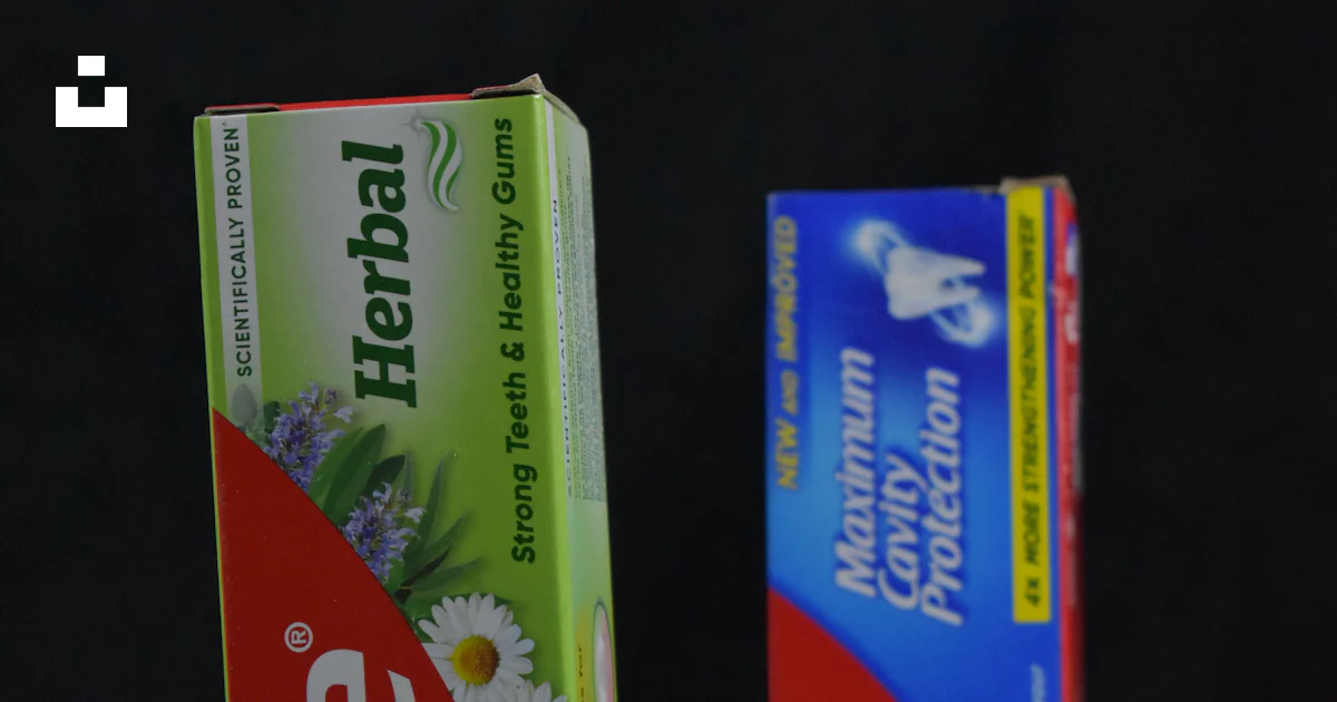 Two Part Toothpaste Two tubes of toothpaste sitting next to each other photo – Free ...