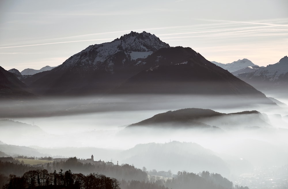 a view of a mountain range covered in fog