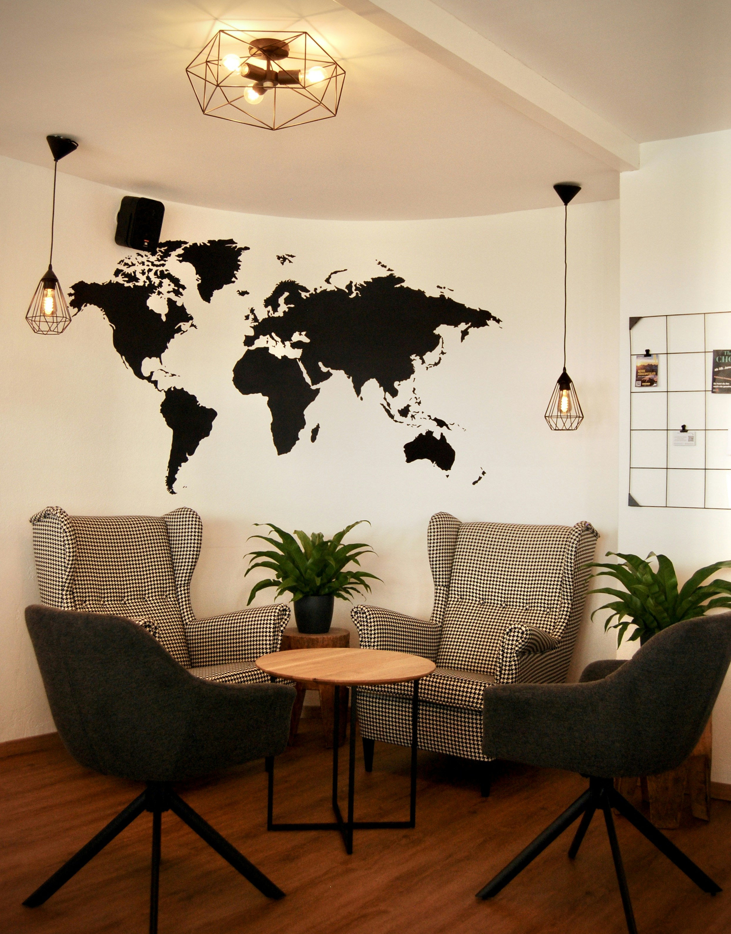 a living room with two chairs and a table