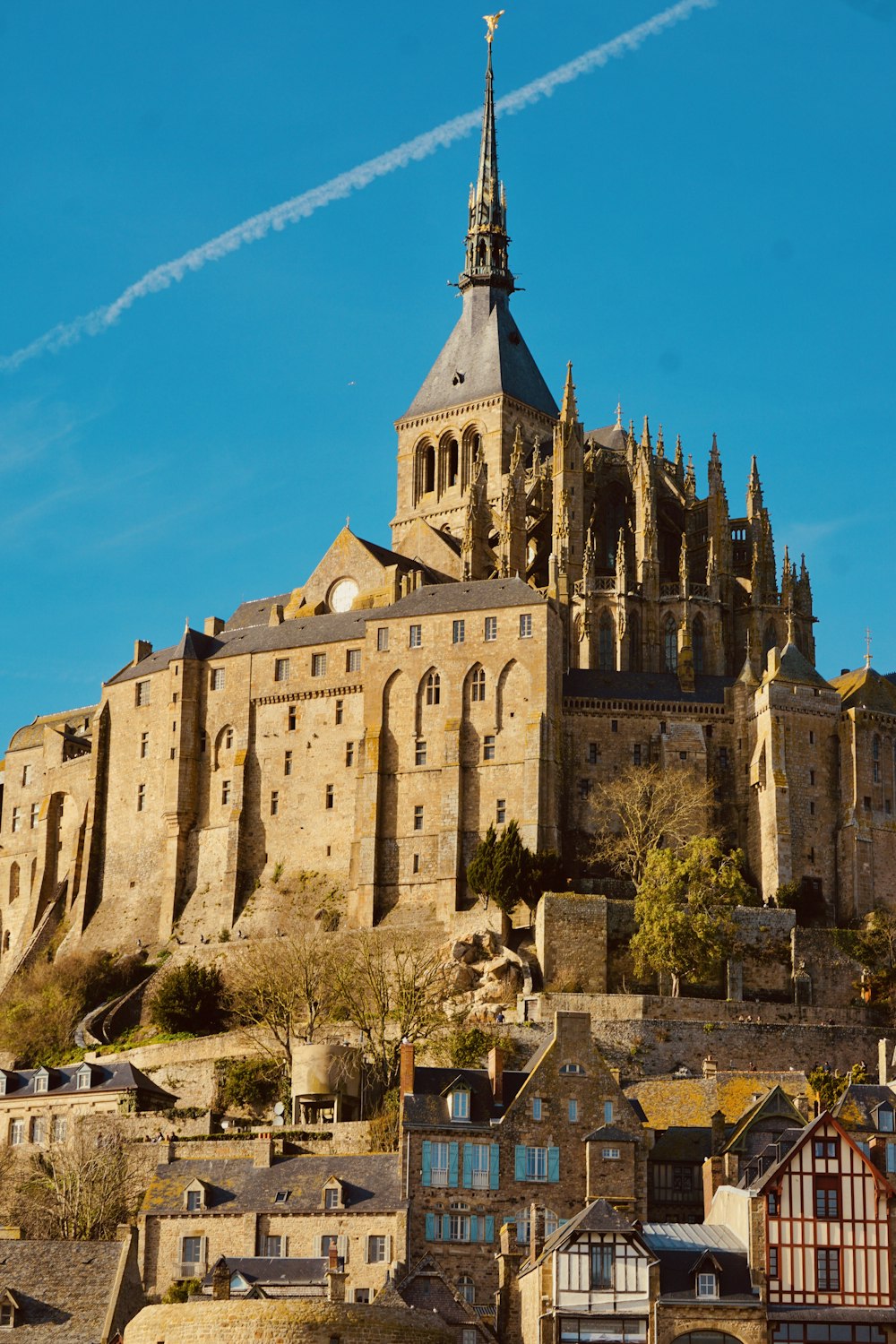 a castle on top of a hill with a sky line in the background