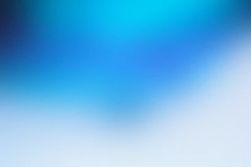a blurry image of a blue and white background