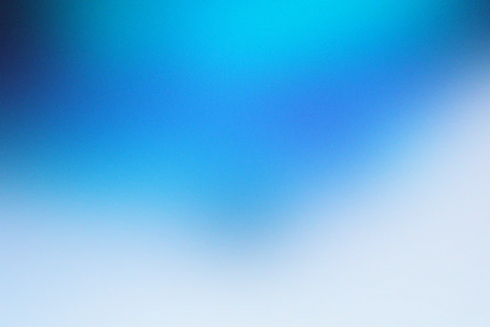 a blurry image of a blue and white background