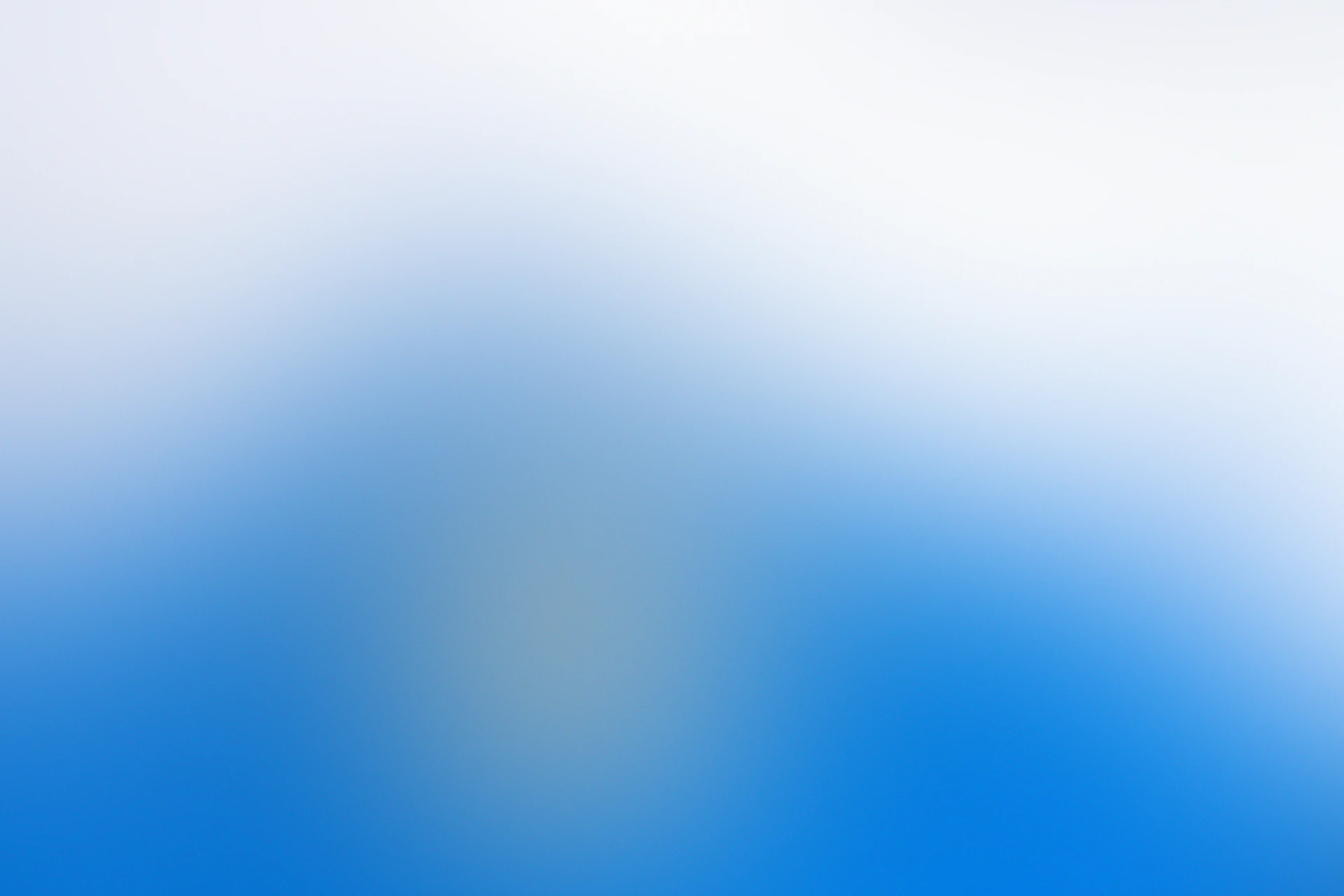A soft gradient shifting from white to bright blue