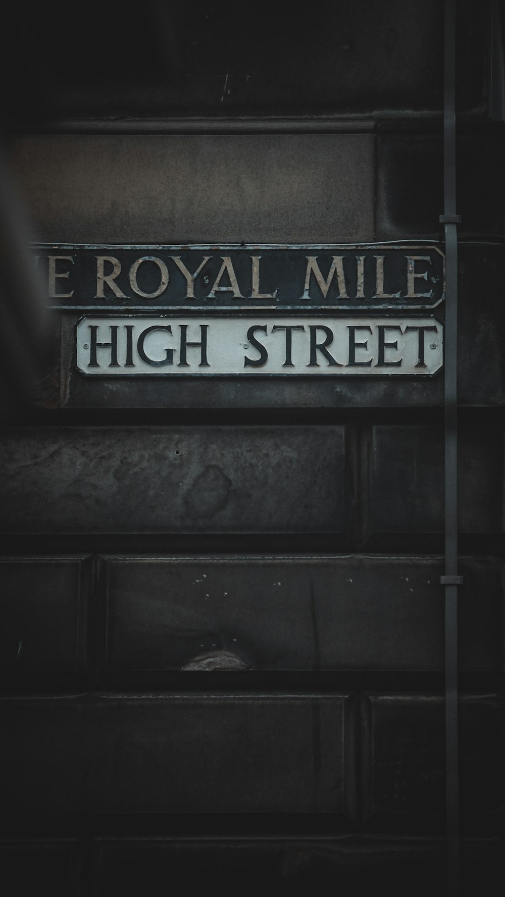 a black and white photo of a street sign