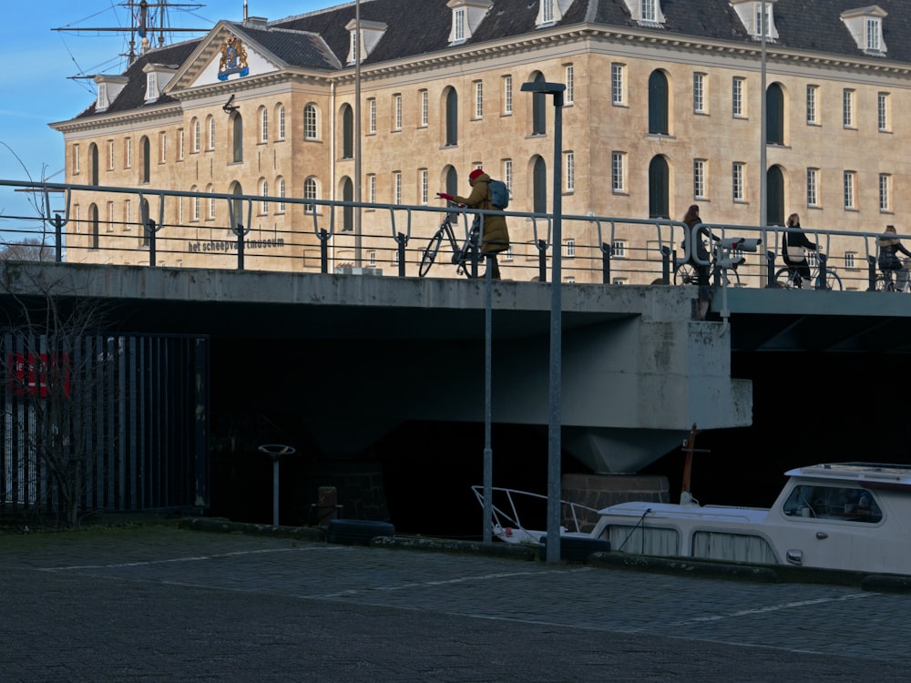 a group of people riding bikes across a bridge