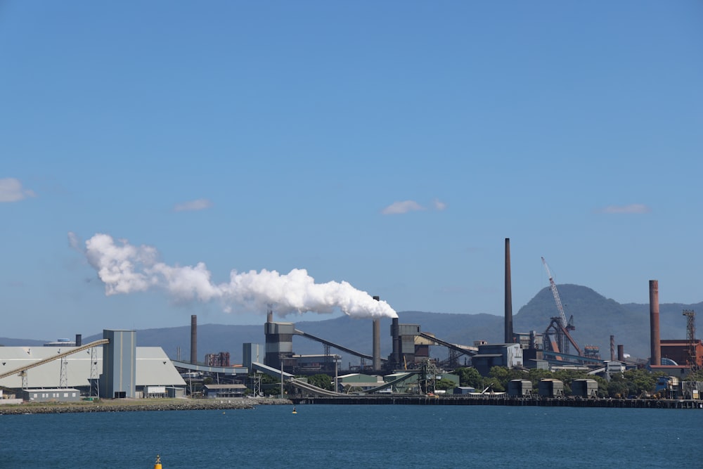 a factory with smoke coming out of it's stacks