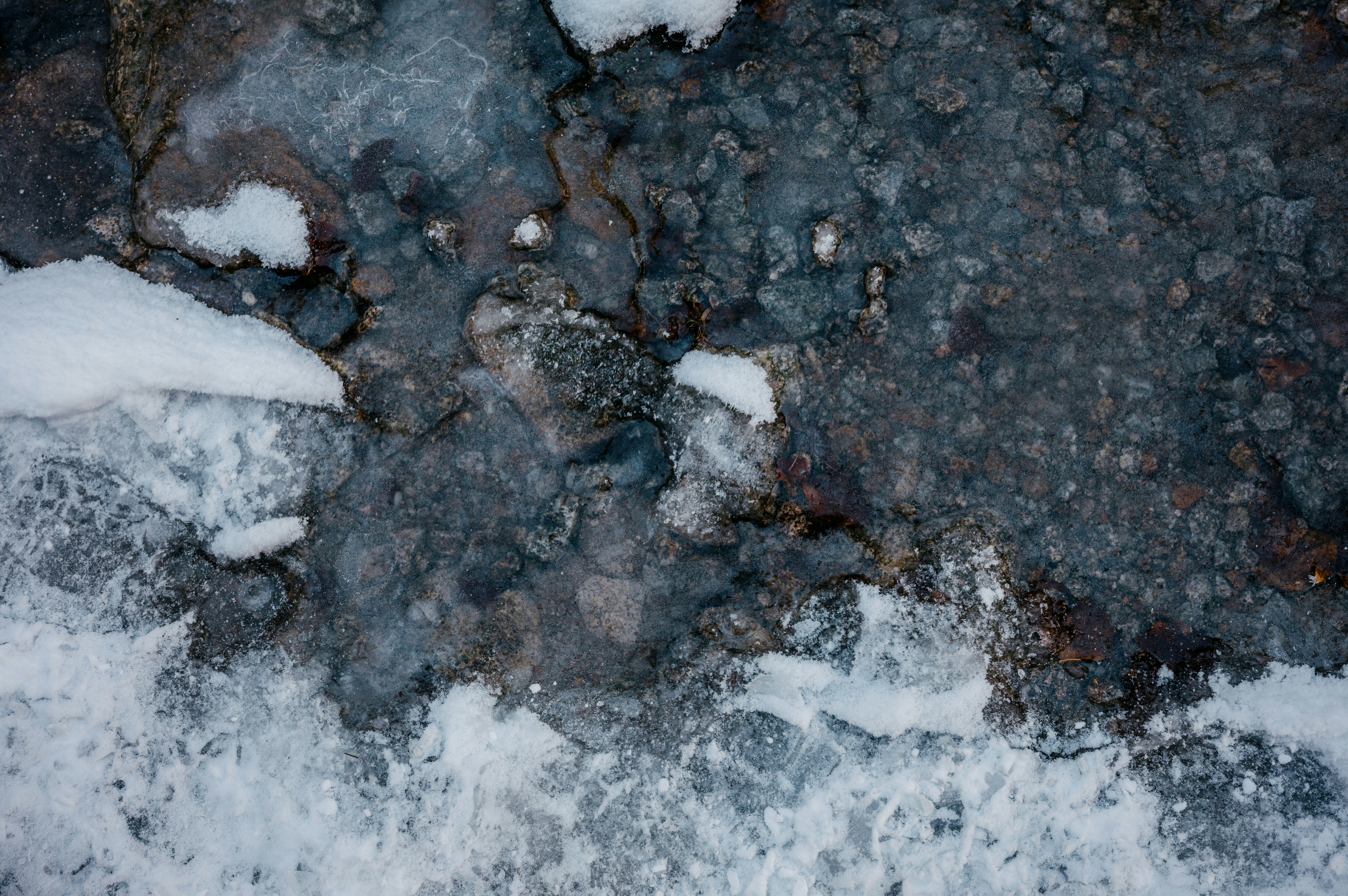 an aerial view of snow and ice on the ground