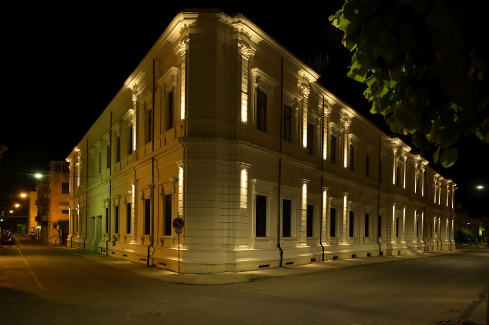 a large building with a lot of windows lit up at night