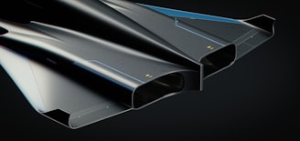 a close up of a metal object on a black background