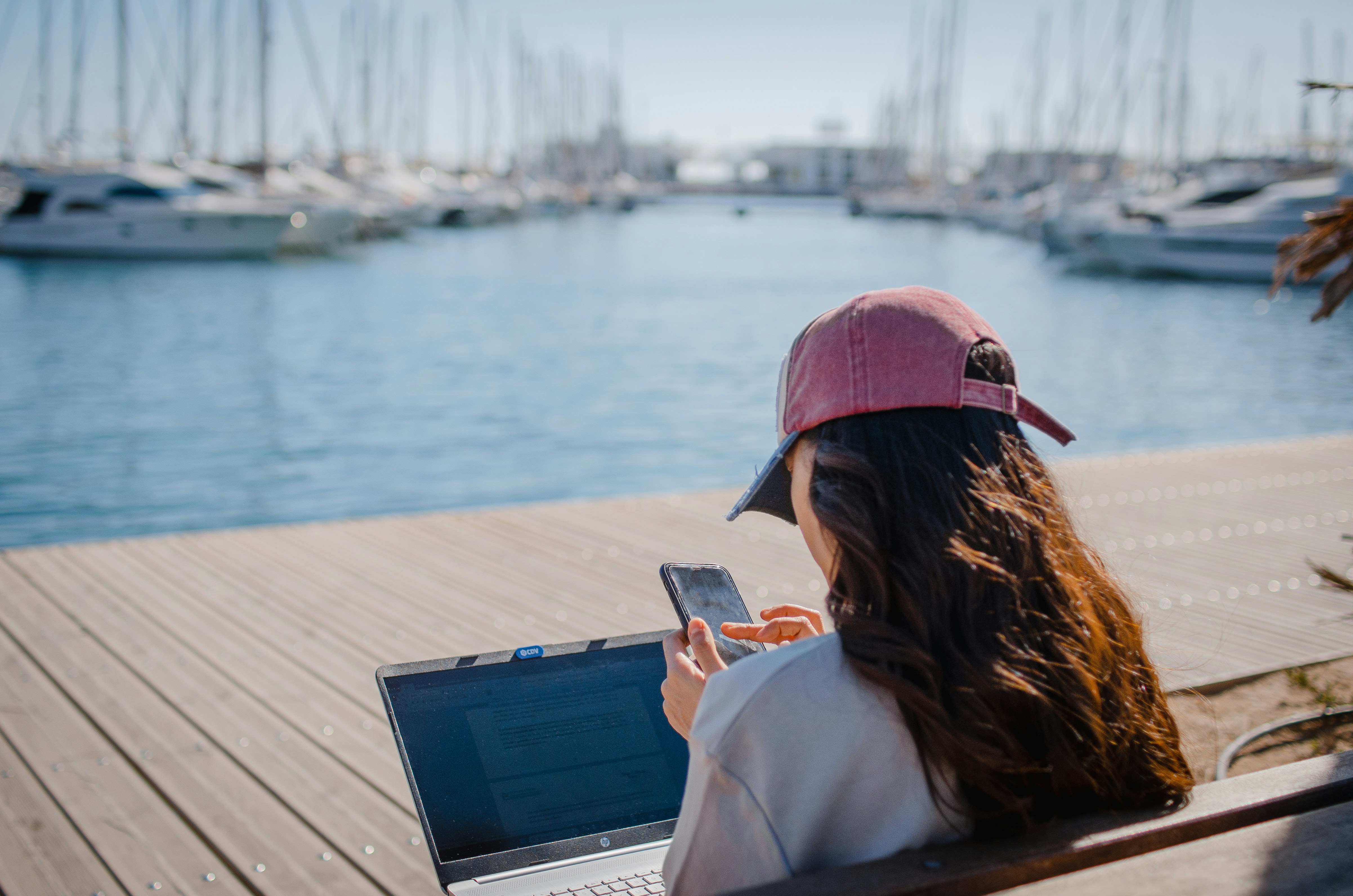 Lady with a phone and laptop