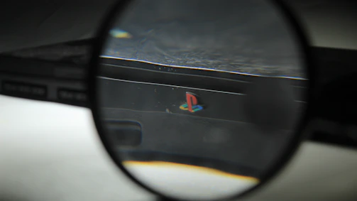 a close up of a magnifying glass with a logo on it
