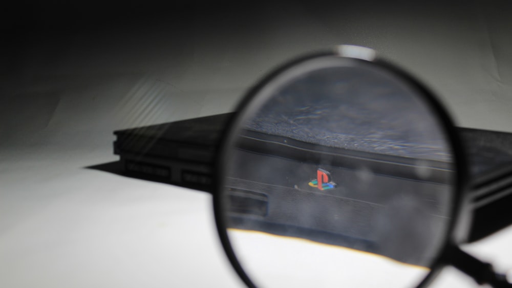 a close up of a magnifying glass on a table