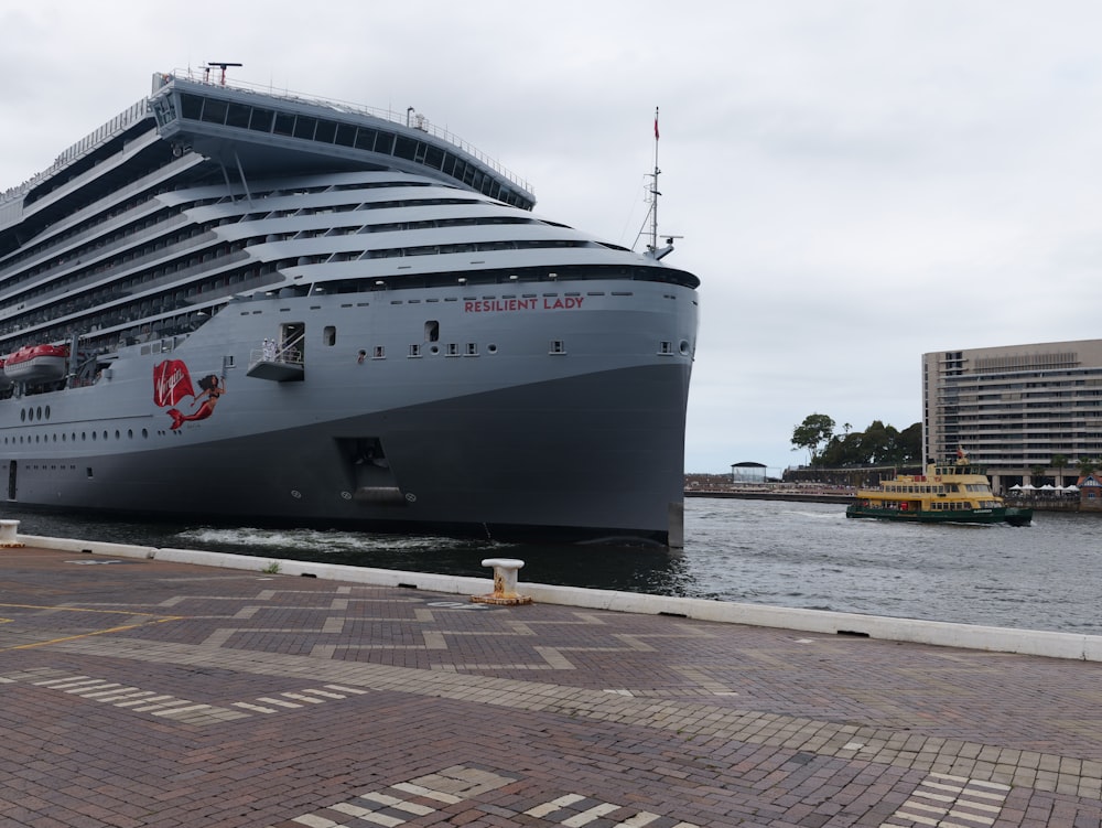 a large cruise ship docked in a harbor