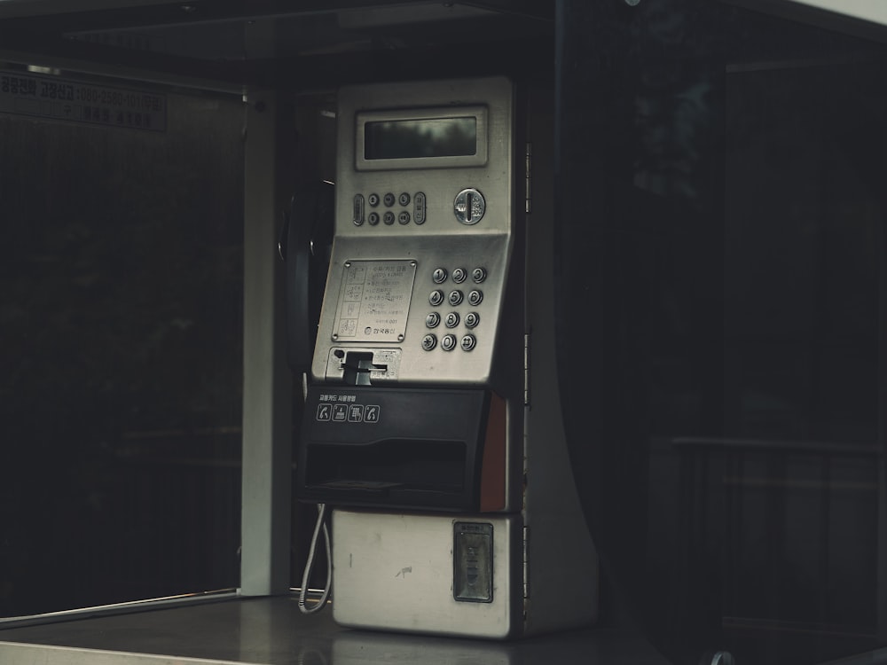 a pay phone sitting on top of a counter