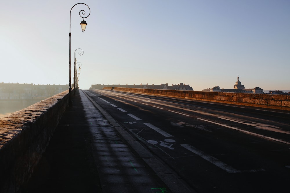 a street with a lamp post on the side of it