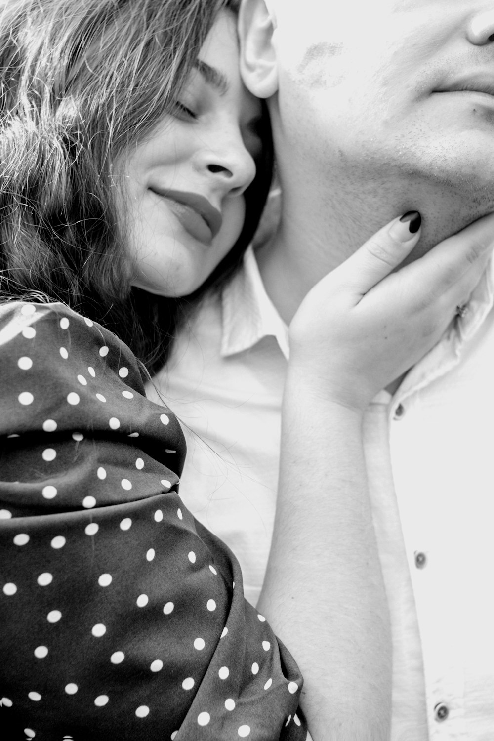 a black and white photo of a man and a woman