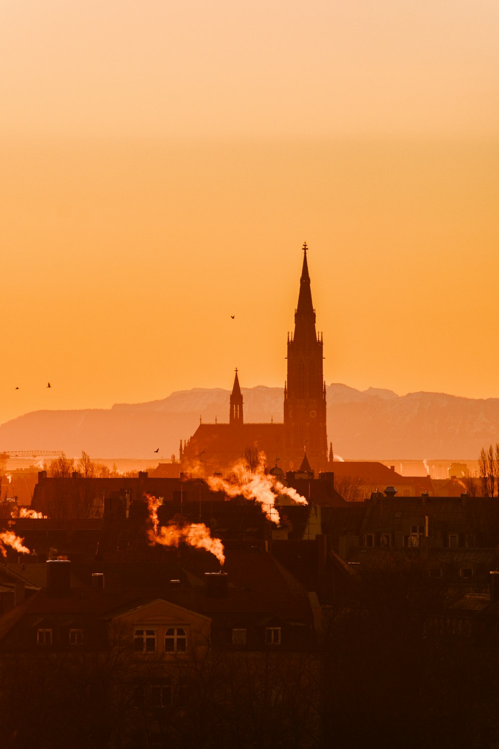 a view of a city with a clock tower in the background