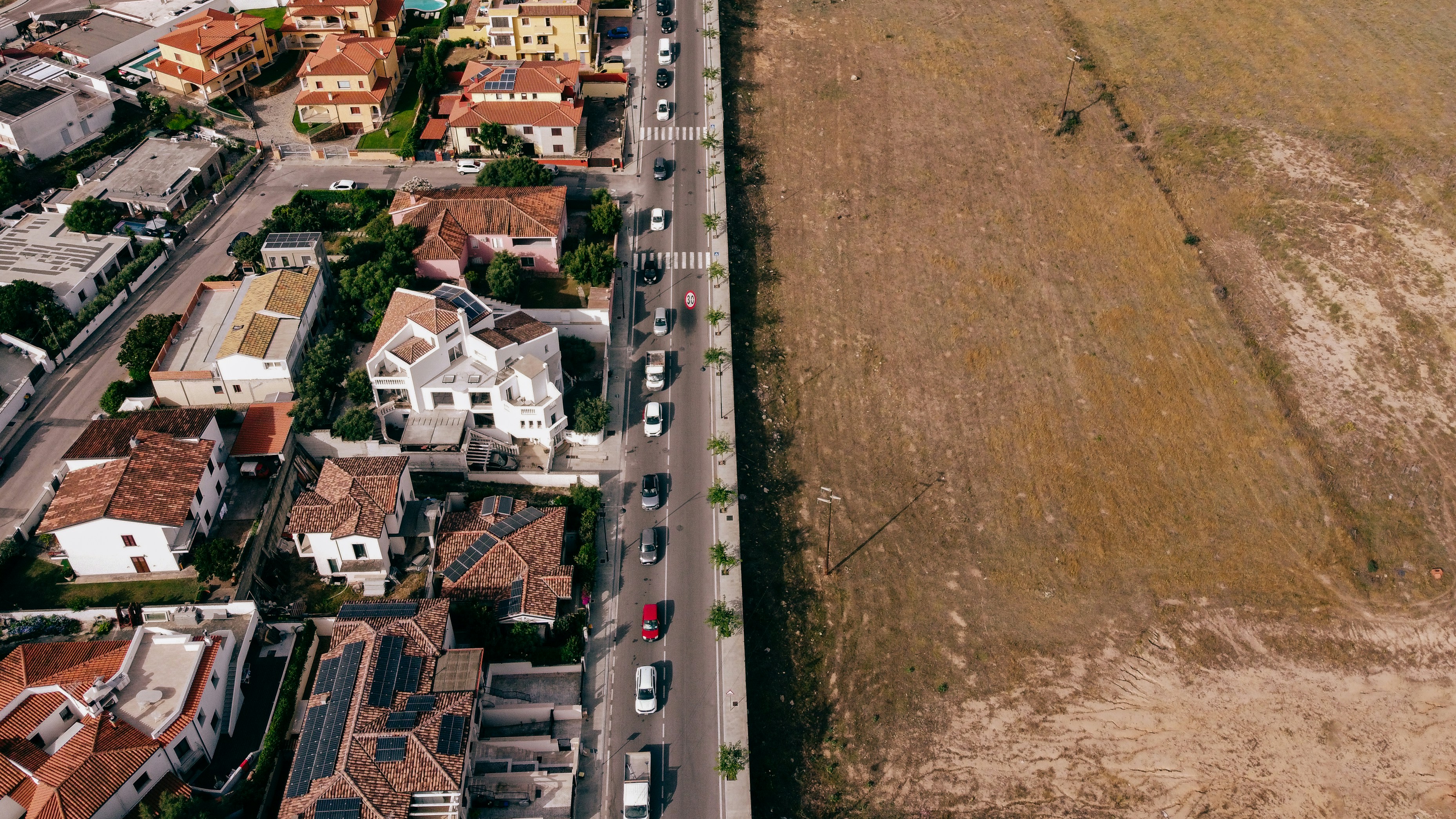 an aerial view of a city with a lot of houses
