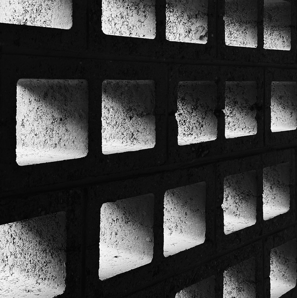 a black and white photo of a brick wall