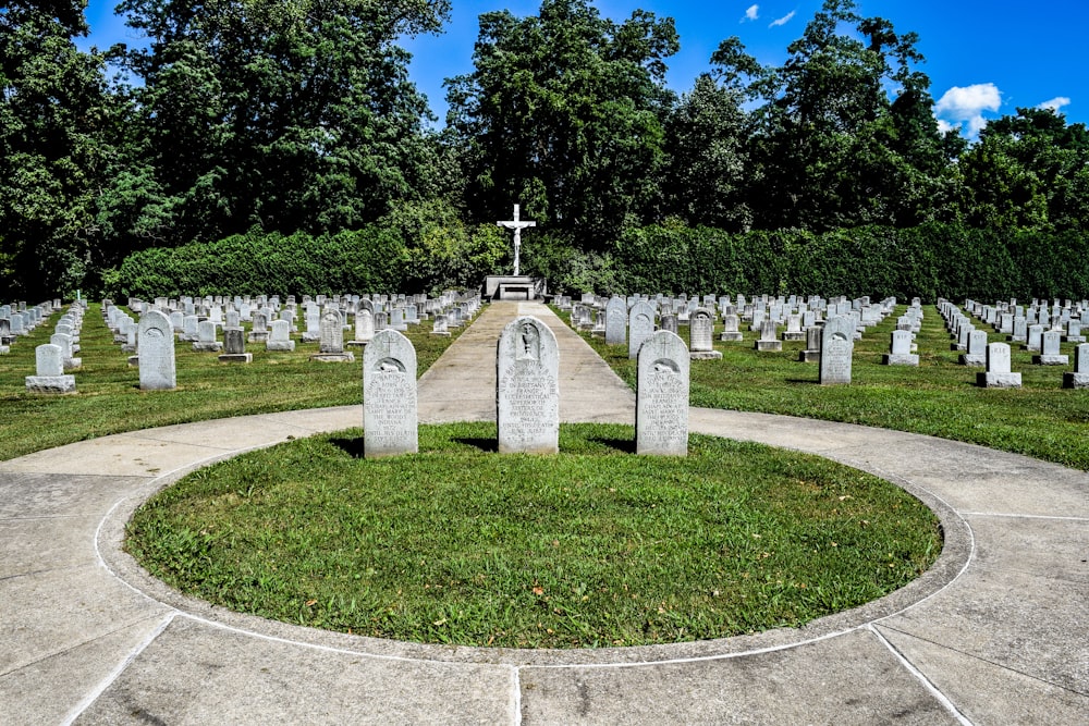 a cemetery with a cross in the middle of it