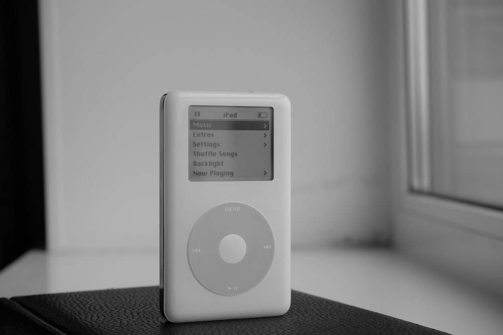 a black and white photo of an ipod