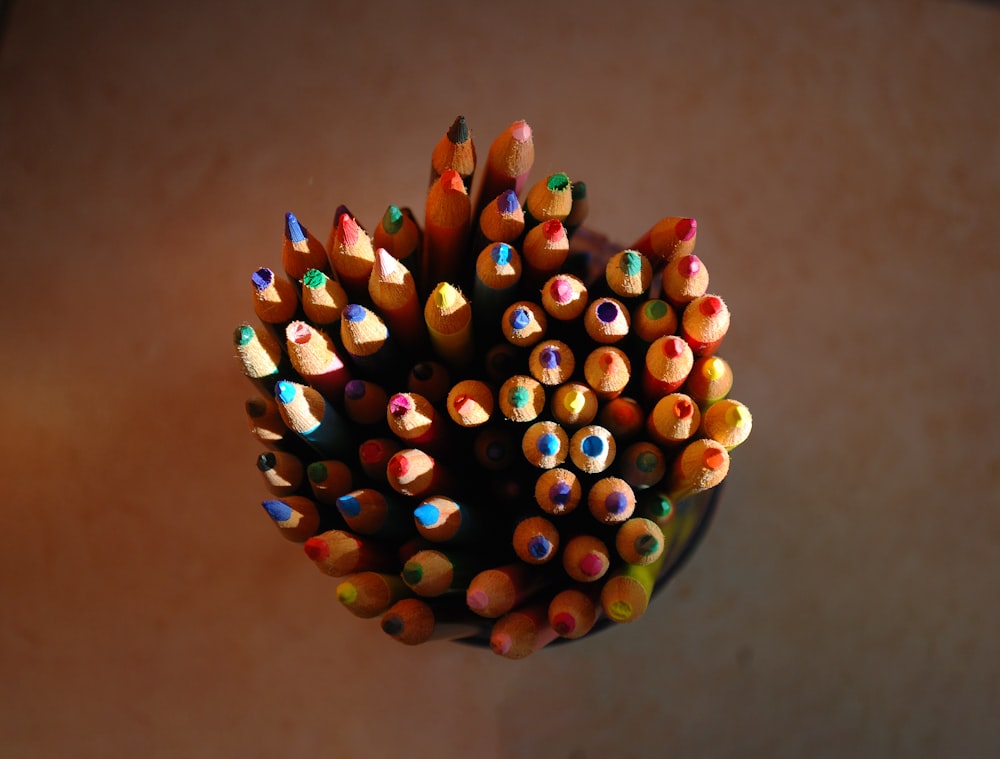 a close up of a bunch of colored pencils